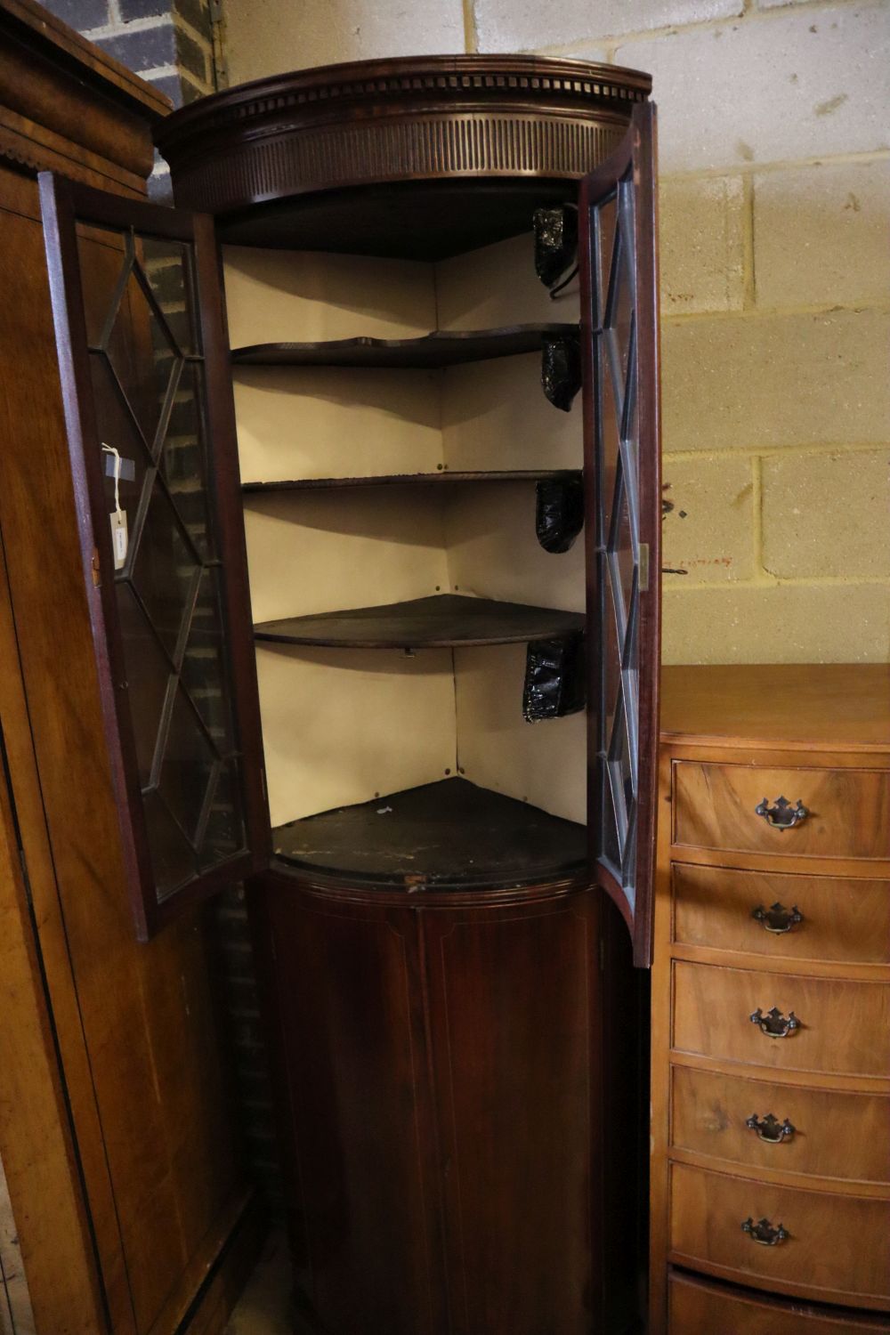 An Edwardian mahogany and boxwood-strung bow-fronted glazed corner cabinet, width 68cm depth 45cm height 208cm